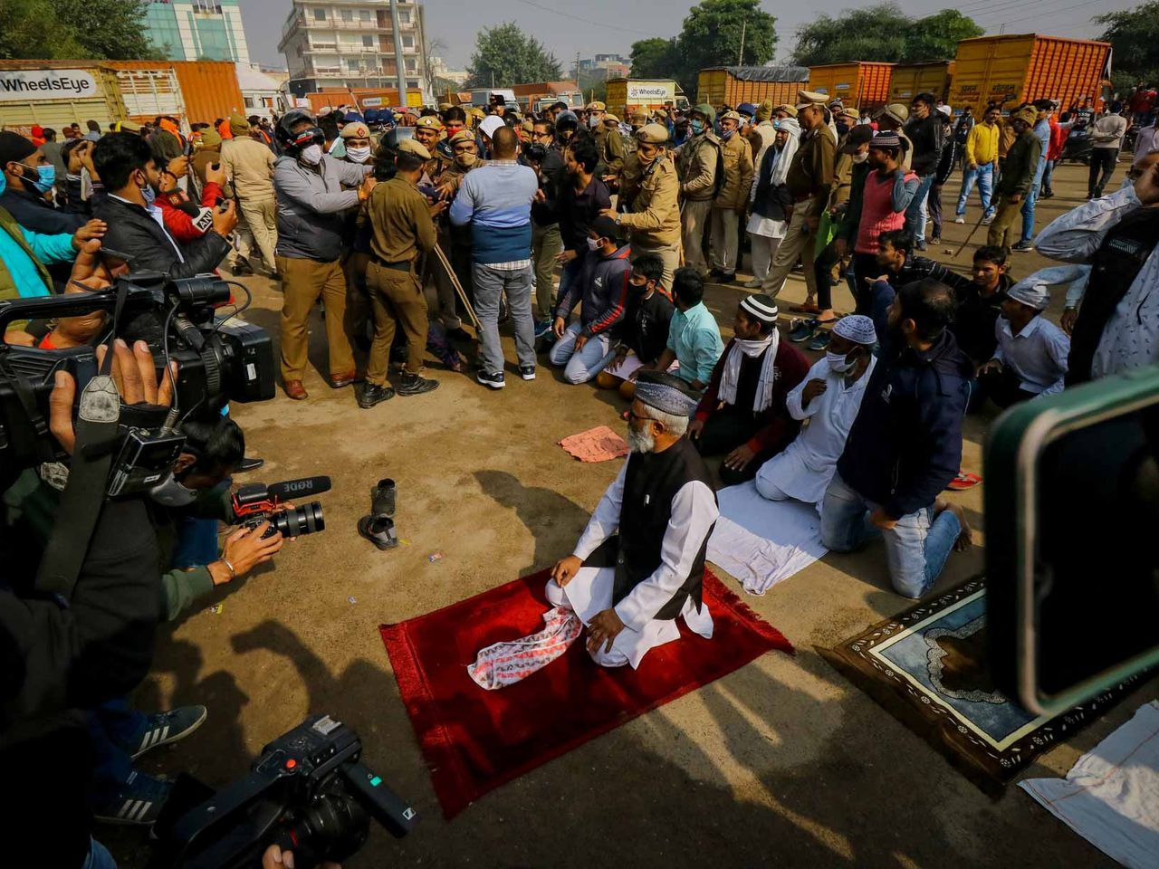 Muslim Devotees offering Namaz in the Presence of heavy Police force at Sector 37 in Gurgaon.